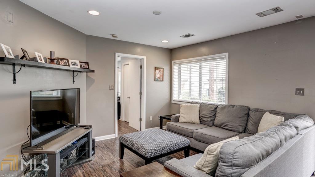 Spacious living room with a secondary bedroom off to the right.