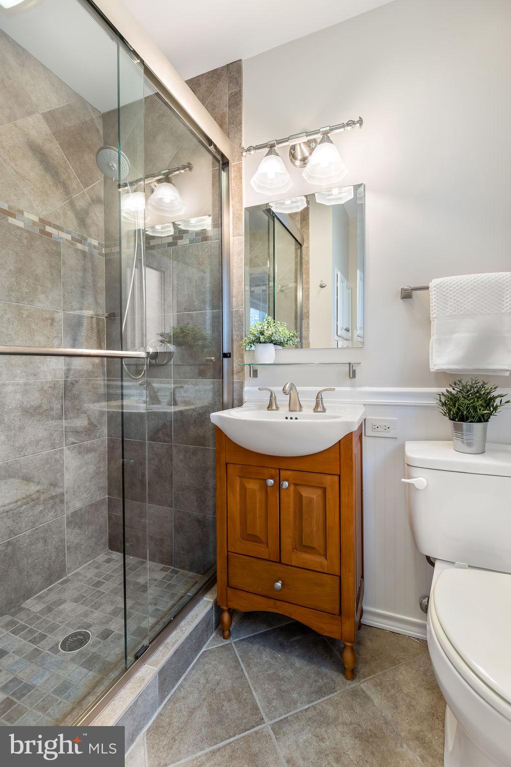 3103 Valley Lane Falls Church, VA 22044 - Photo 10 of 25 a bathroom with a sink mirror and toilet
