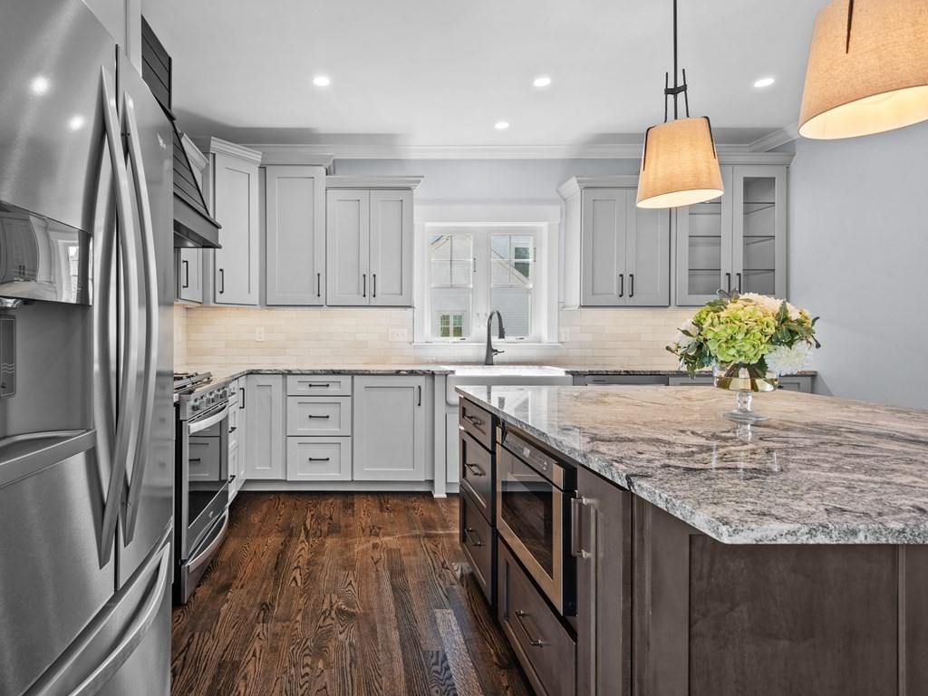 87 Brigham Hill Road Attleboro, MA 02703 - Photo 15 of 42 a kitchen with stainless steel appliances granite countertop a sink stove and refrigerator