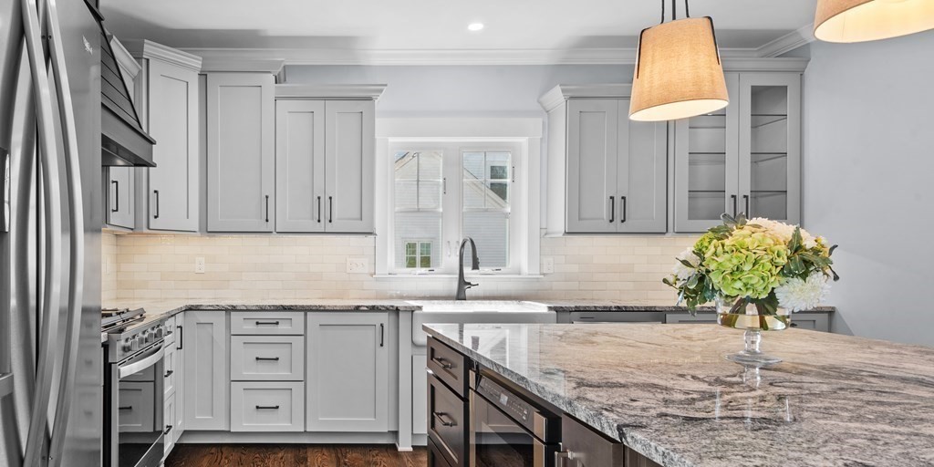 87 Brigham Hill Road Attleboro, MA 02703 - Photo 16 of 42 a kitchen with granite countertop a sink stainless steel appliances and cabinets