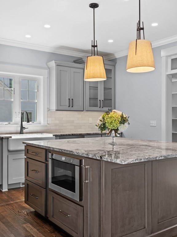 87 Brigham Hill Road Attleboro, MA 02703 - Photo 17 of 42 a kitchen with stainless steel appliances granite countertop a sink a stove and a wooden floors