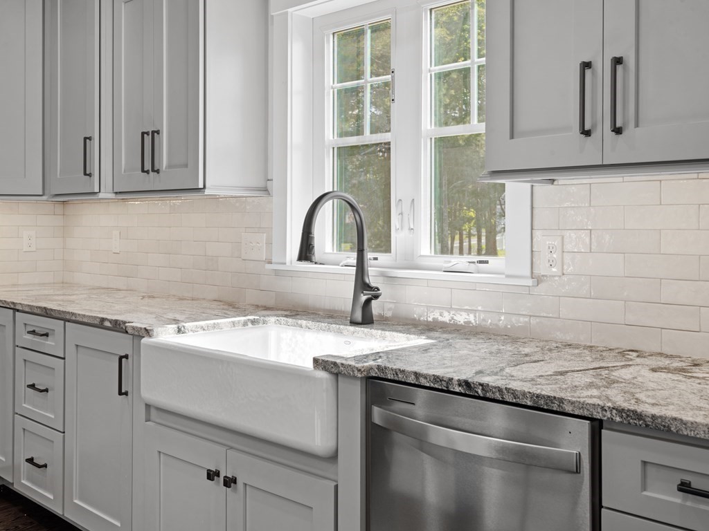 87 Brigham Hill Road Attleboro, MA 02703 - Photo 19 of 42 a kitchen with granite countertop a sink and cabinets