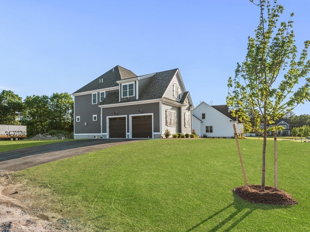 87 Brigham Hill Road Attleboro, MA 02703 - Photo 3 of 42 a front view of a house with a yard