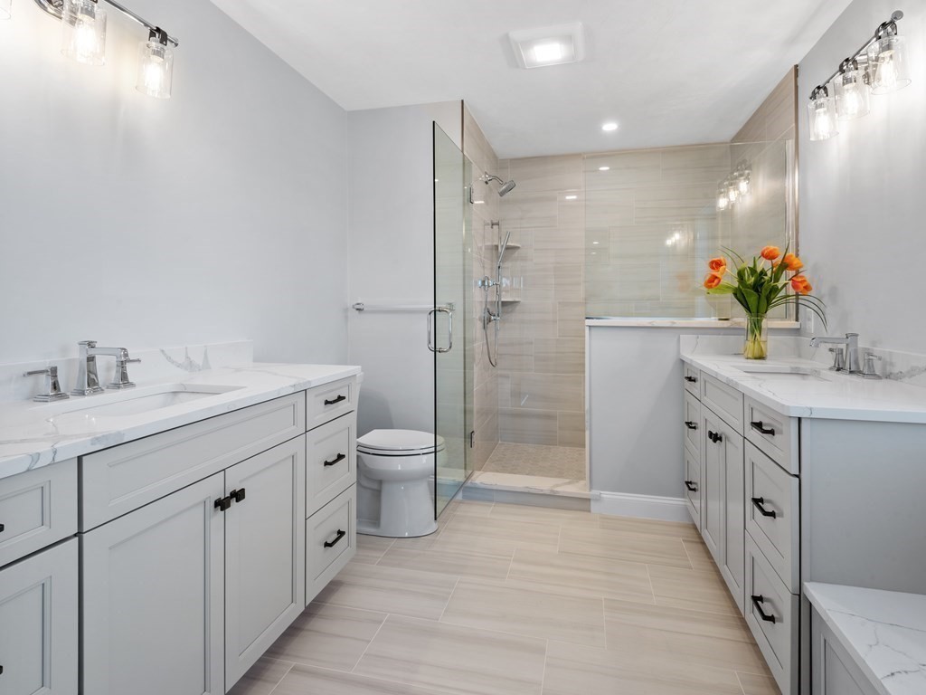 87 Brigham Hill Road Attleboro, MA 02703 - Photo 31 of 42 a bathroom with a double vanity sink toilet and shower