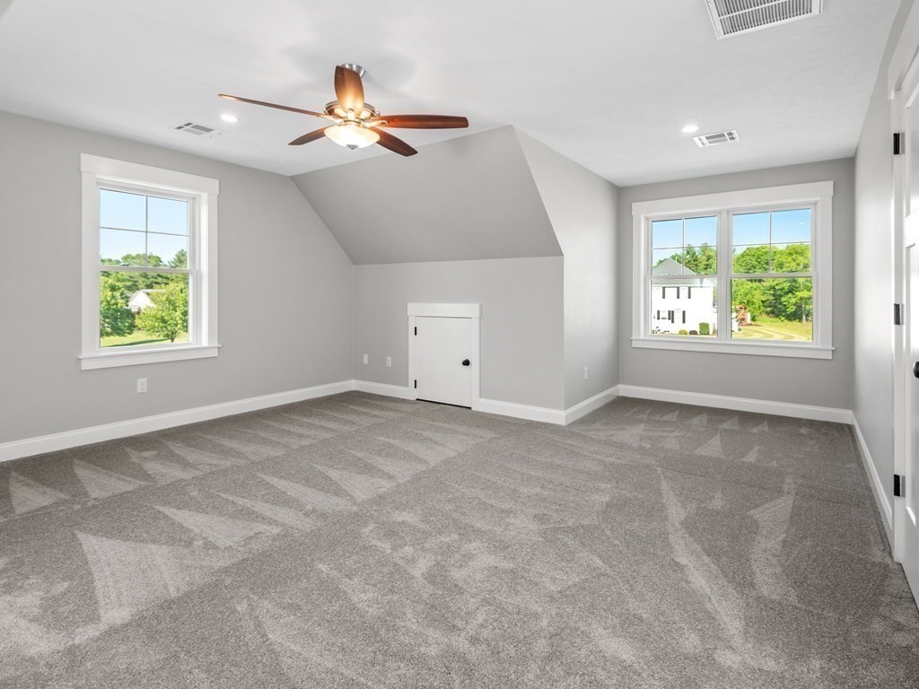 87 Brigham Hill Road Attleboro, MA 02703 - Photo 35 of 42 an empty room with windows and ceiling fan