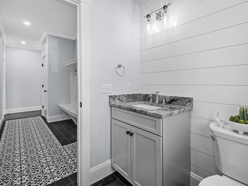 87 Brigham Hill Road Attleboro, MA 02703 - Photo 4 of 42 a bathroom with a granite countertop sink and a toilet