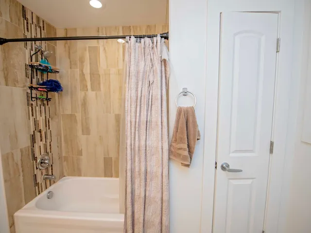 a bathroom with a shower curtain