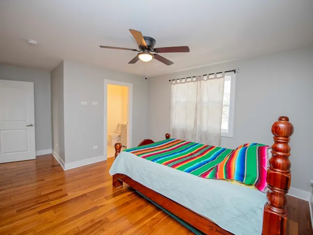 a room with a bed and a chandelier