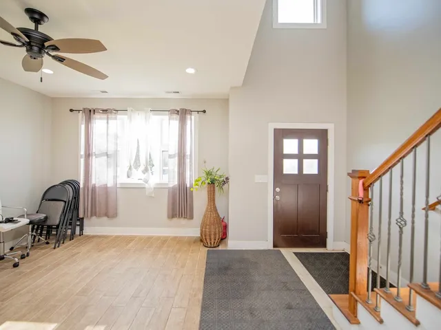 a view of a livingroom with a window and couch