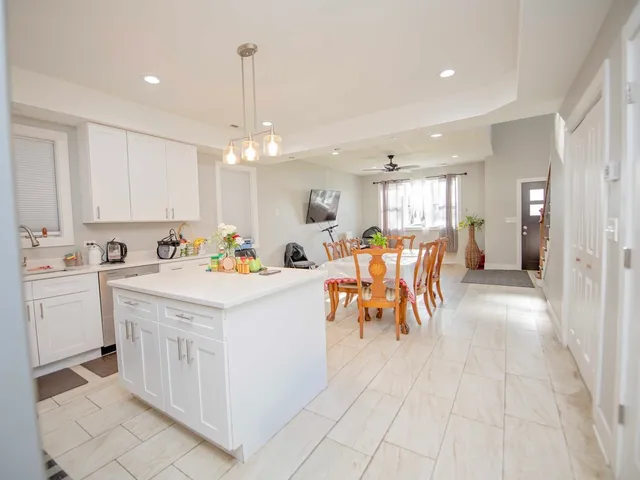 a view of kitchen with cabinets