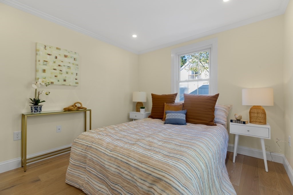 15 Red Acre Road Stow, MA 01775 - Photo 20 of 42 a bedroom with a bed and a table in it