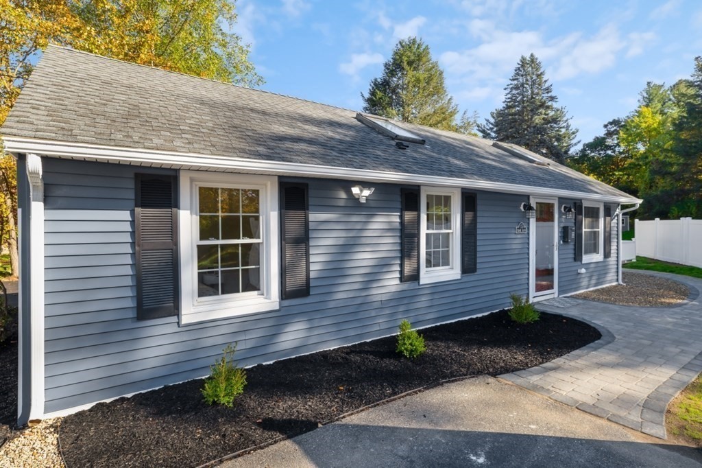 15 Red Acre Road Stow, MA 01775 - Photo 3 of 42 a front view of a house with a yard
