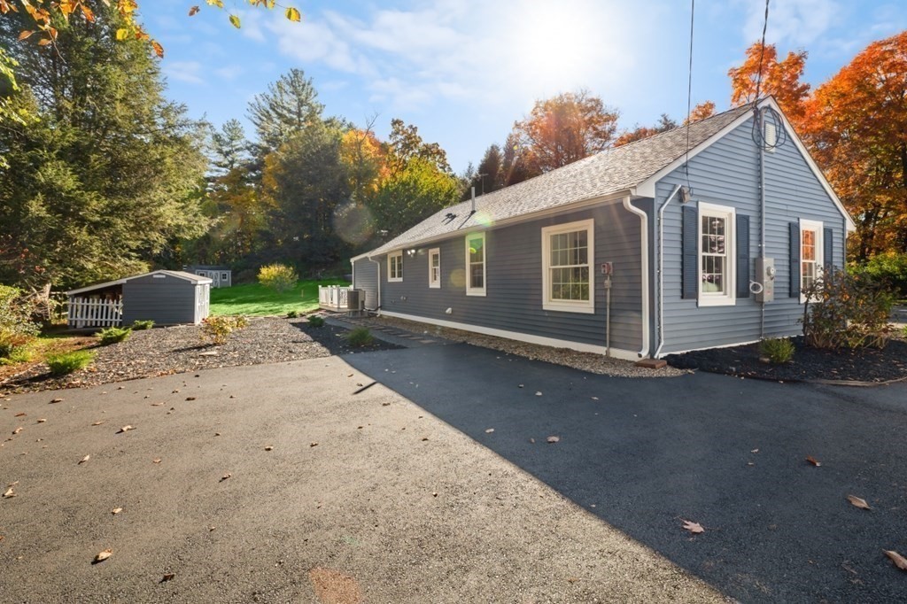 15 Red Acre Road Stow, MA 01775 - Photo 31 of 42 a backyard of a house with table and chairs