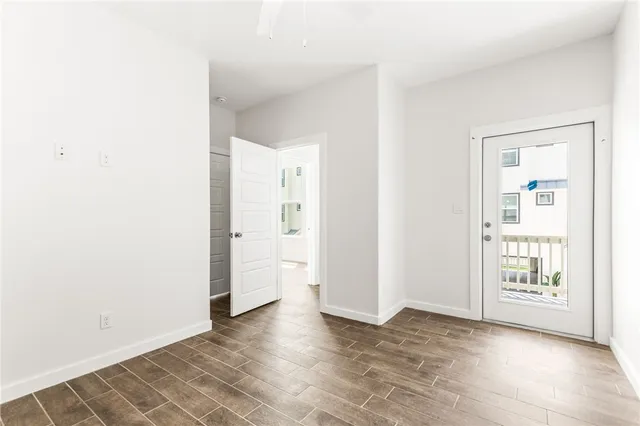 a bathroom with a sink toilet vanity and shower
