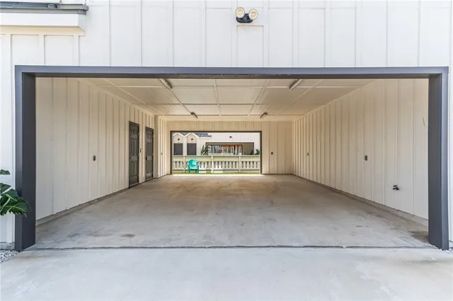 a view of an house with backyard porch and a small cabin