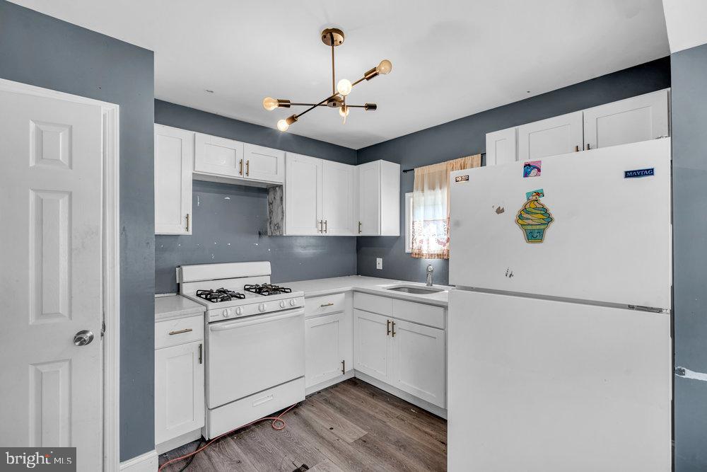 211 Chatham Drive Lindenwold, NJ 08021 - Photo 13 of 42 a kitchen with stainless steel appliances a refrigerator sink and white cabinets