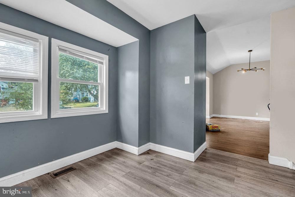 211 Chatham Drive Lindenwold, NJ 08021 - Photo 15 of 42 an empty room with wooden floor and windows