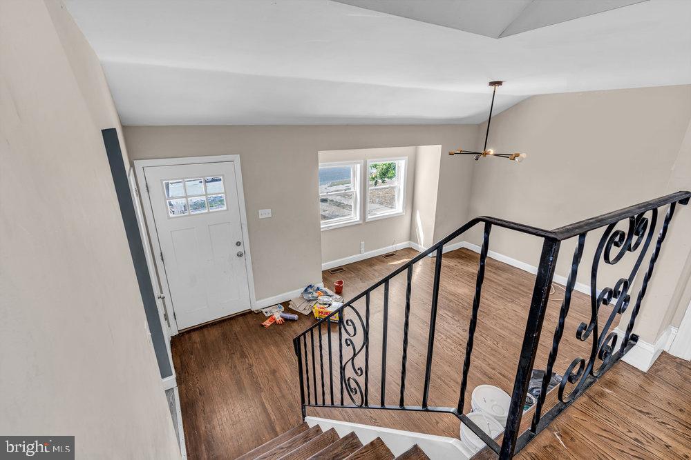 211 Chatham Drive Lindenwold, NJ 08021 - Photo 18 of 42 a view of staircase with lots of frames on wall and wooden floor