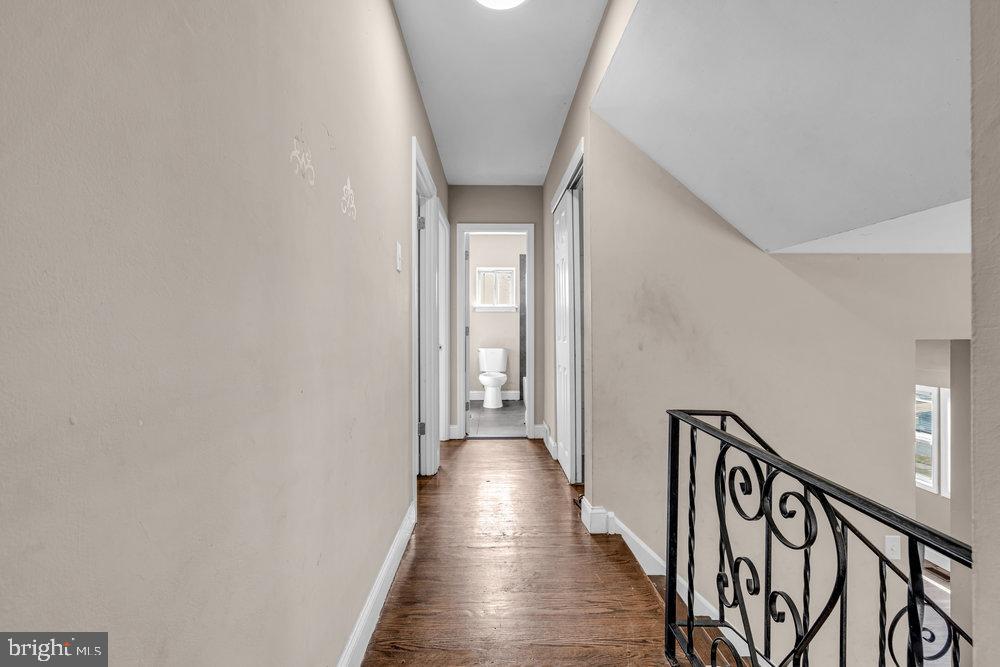 211 Chatham Drive Lindenwold, NJ 08021 - Photo 19 of 42 a view of a hallway with wooden floor and stairs