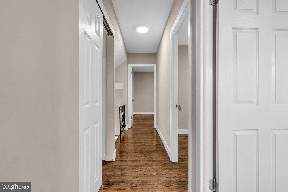 211 Chatham Drive Lindenwold, NJ 08021 - Photo 20 of 42 a view of a hallway with wooden floor and staircase