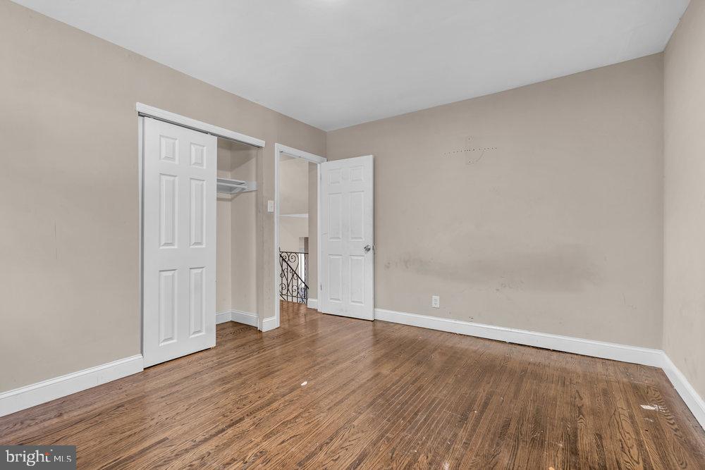 211 Chatham Drive Lindenwold, NJ 08021 - Photo 22 of 42 a view of an empty room with wooden floor