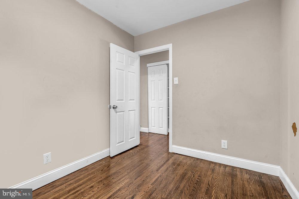 211 Chatham Drive Lindenwold, NJ 08021 - Photo 24 of 42 a view of an empty room with wooden floor