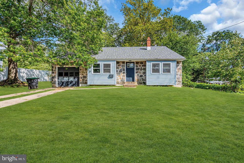 211 Chatham Drive Lindenwold, NJ 08021 - Photo 4 of 42 a front view of a house with a garden and trees