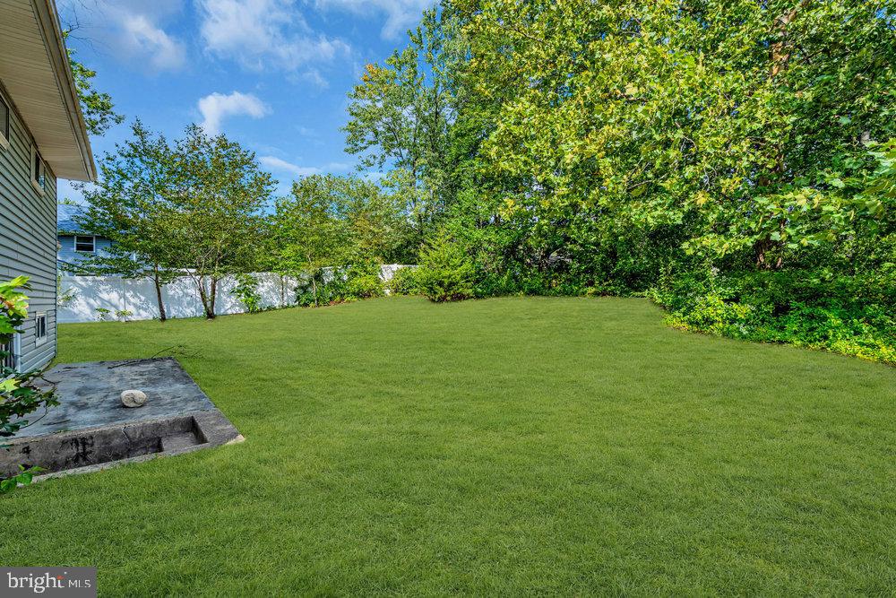 211 Chatham Drive Lindenwold, NJ 08021 - Photo 42 of 42 a view of a grassy field with trees