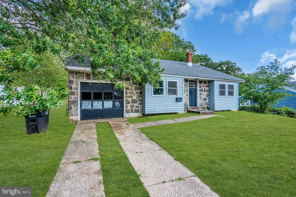 211 Chatham Drive Lindenwold, NJ 08021 - Photo 5 of 42 a front view of a house with a yard