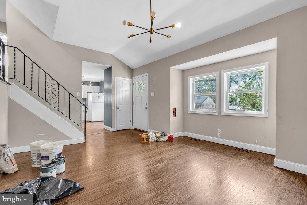 211 Chatham Drive Lindenwold, NJ 08021 - Photo 10 of 42 a view of an empty room with window and wooden floor