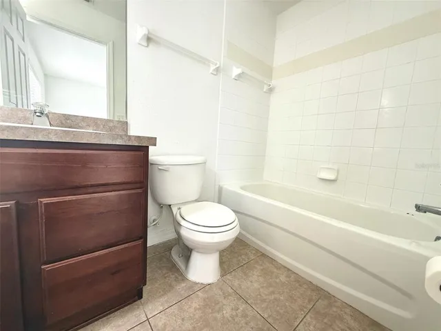 a bathroom with a toilet a sink and a bathtub