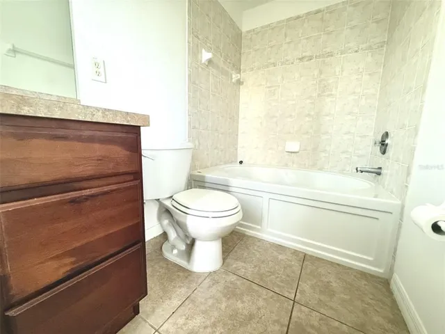 a bathroom with a toilet a sink and a bathtub