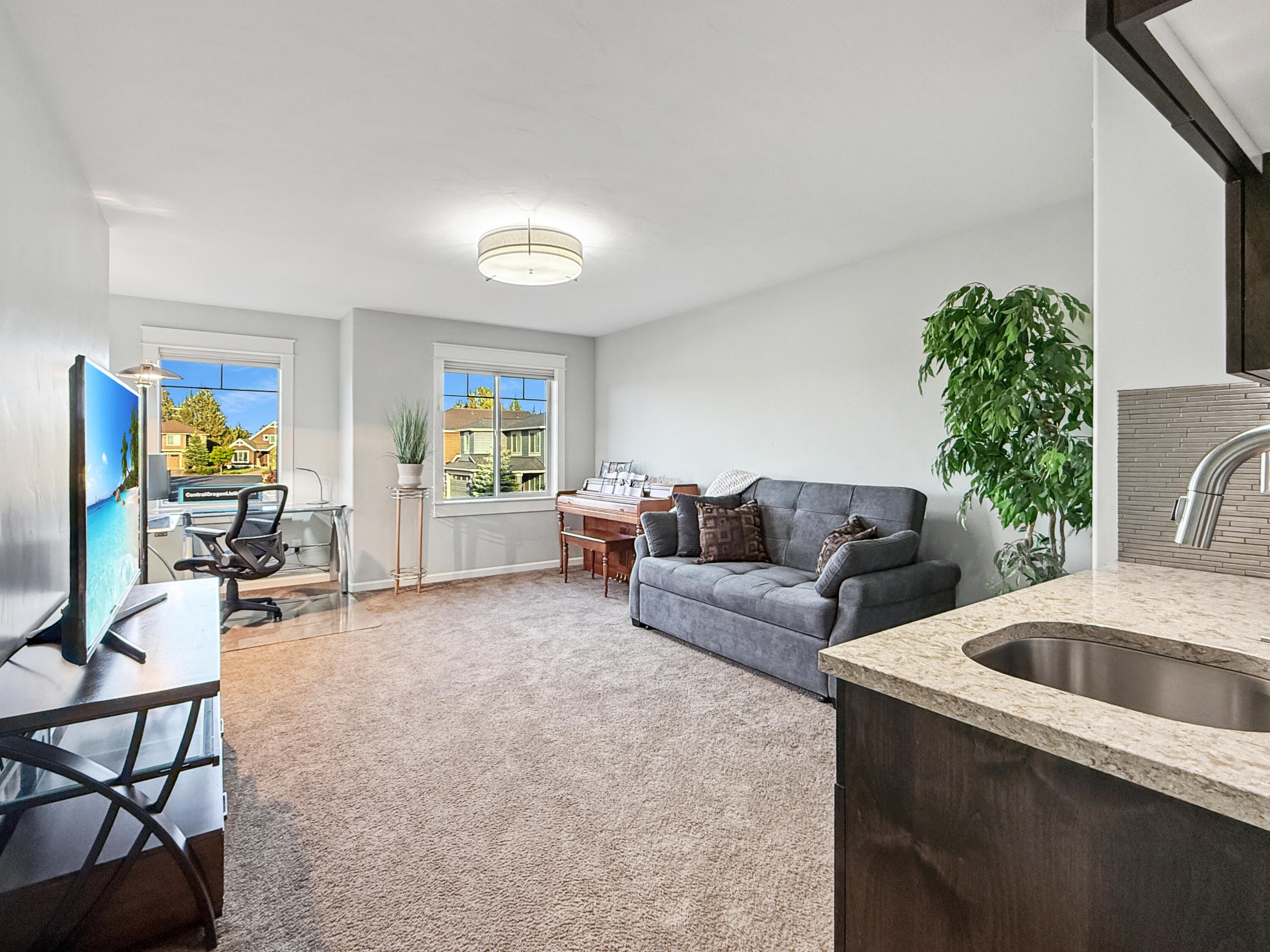 61072 Manhae Loop Bend, OR 97702 - Photo 27 of 63 a living room with furniture and a potted plant