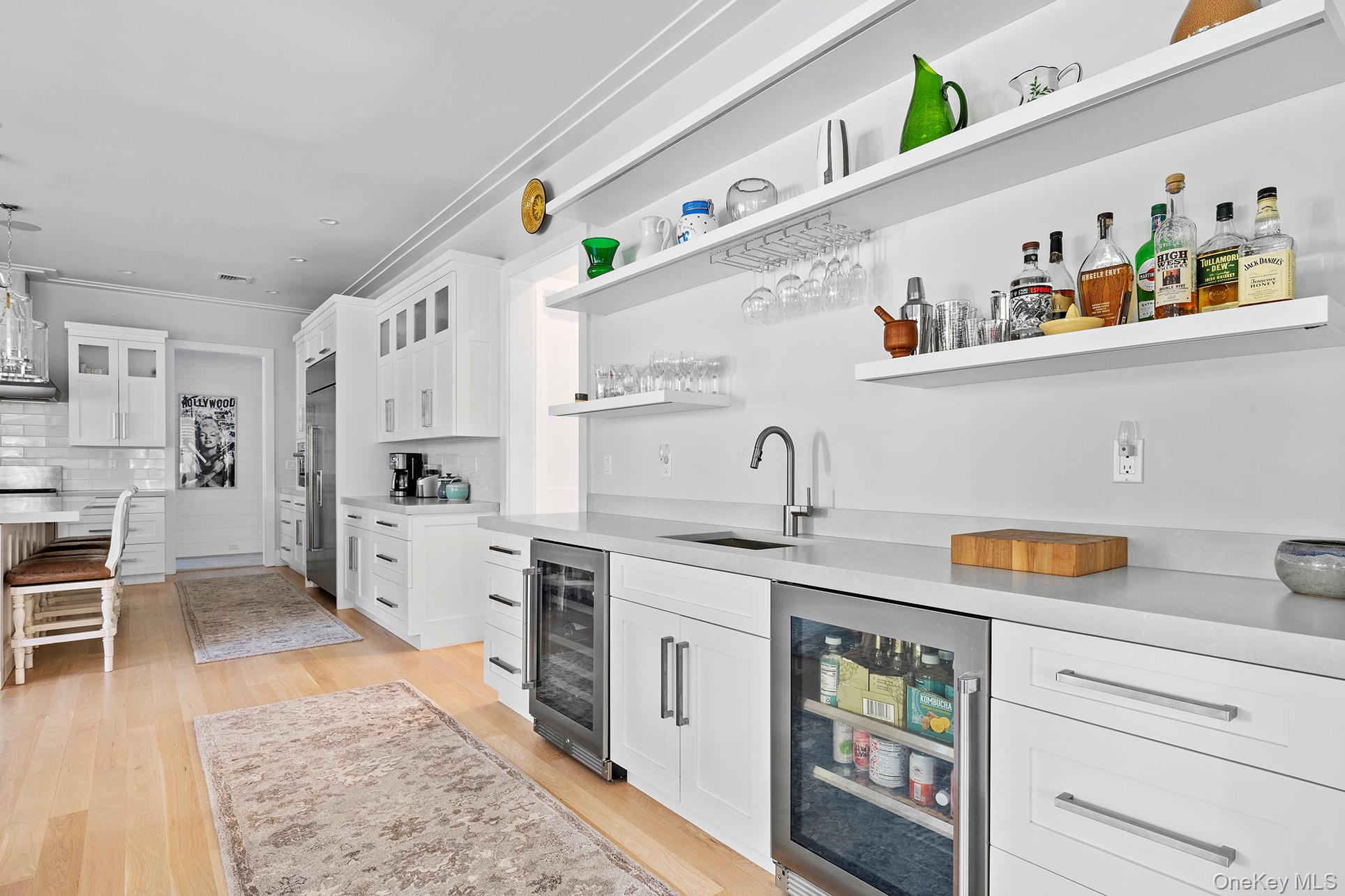 41 Arbutus Road Quogue, NY 11959 - Photo 12 of 35 a kitchen with stainless steel appliances granite countertop a sink and cabinets