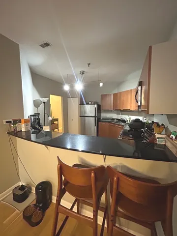 a kitchen with a table and chairs in it
