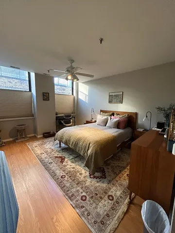 a bedroom with double bed and a large mirror