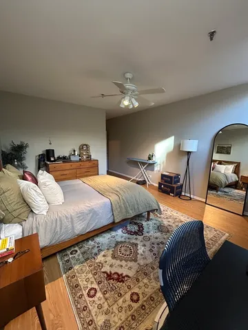 a bedroom with bed and window