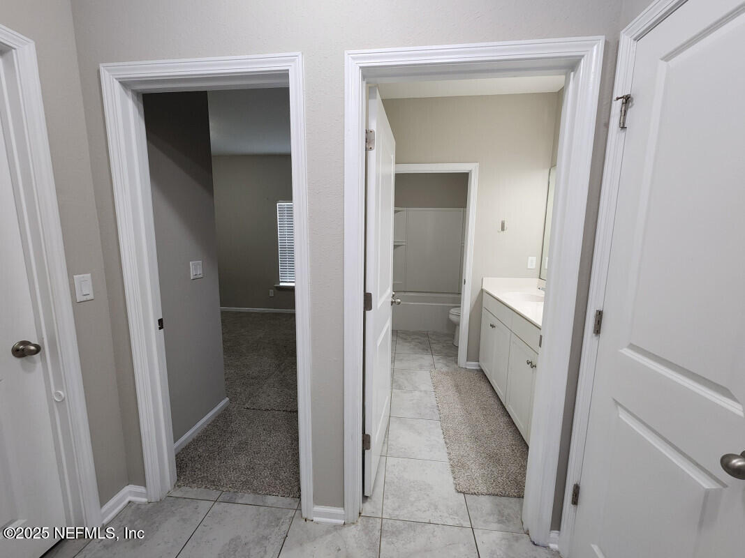 855 Sycamore Way Orange Park, FL 32073 - Photo 17 of 43 a view of a hallway to rooms