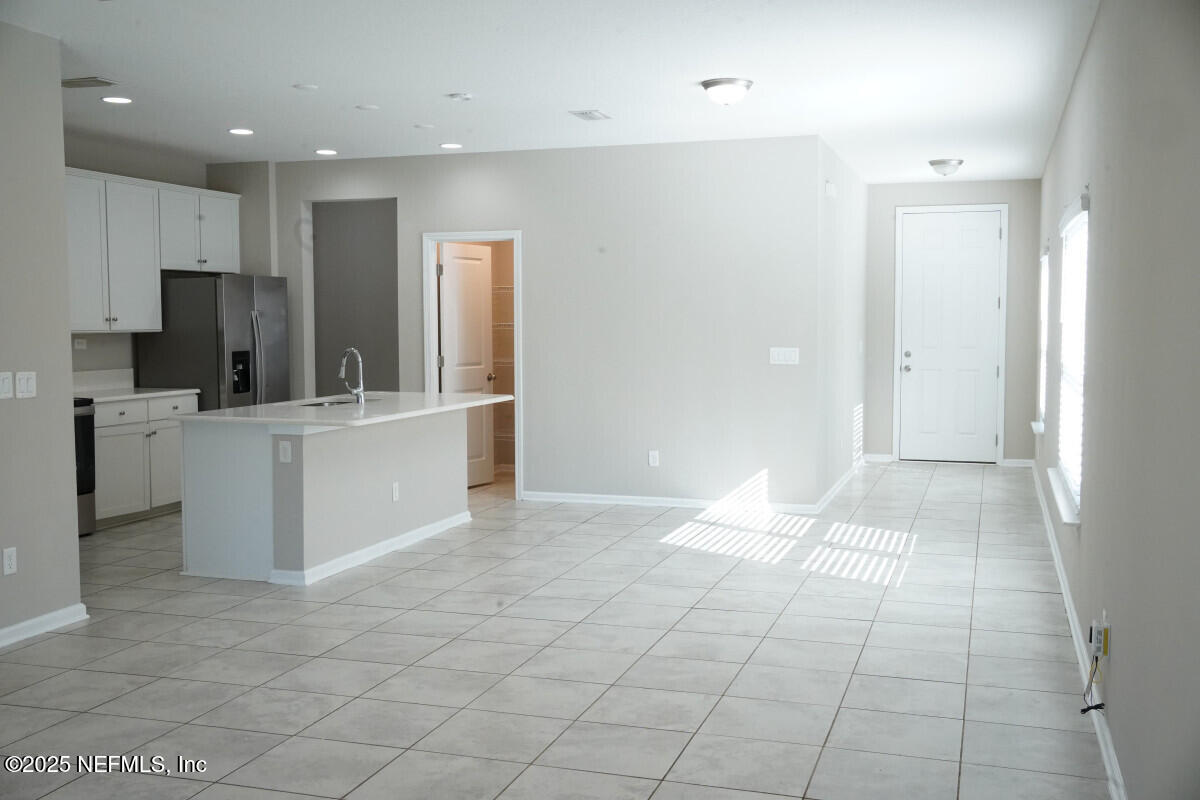 855 Sycamore Way Orange Park, FL 32073 - Photo 20 of 43 a kitchen with stainless steel appliances a refrigerator and a stove top oven