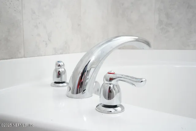 a view of a patio with a table and chairs