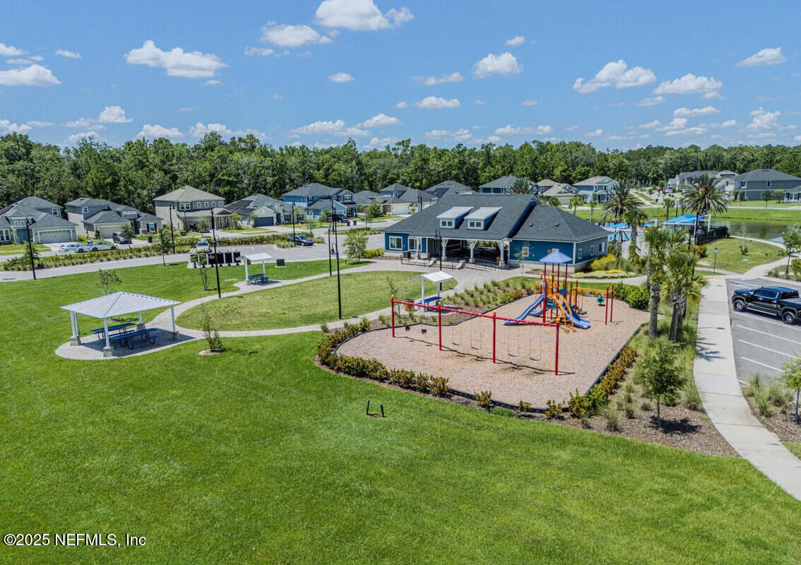 855 Sycamore Way Orange Park, FL 32073 - Photo 38 of 43 a view of a house with swimming pool and a yard