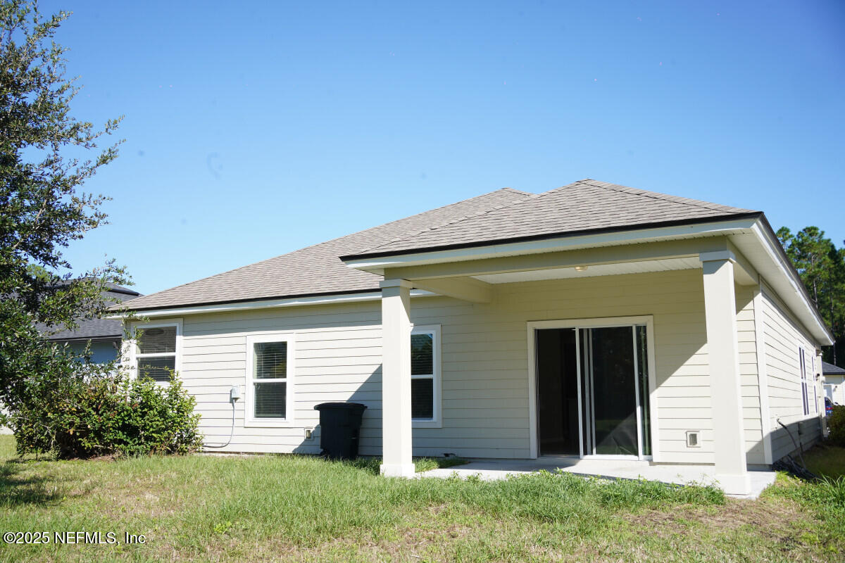 855 Sycamore Way Orange Park, FL 32073 - Photo 4 of 43 a view of a house with a yard
