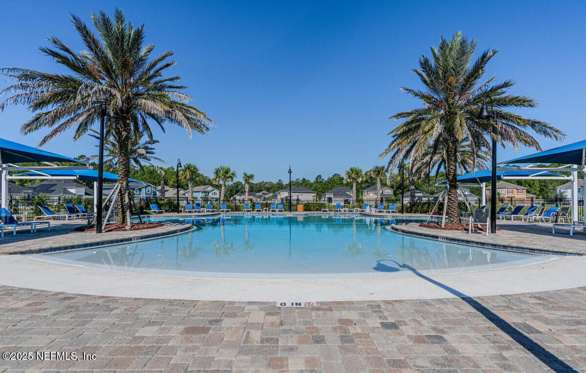 855 Sycamore Way Orange Park, FL 32073 - Photo 42 of 43 a view of a swimming pool and a chair