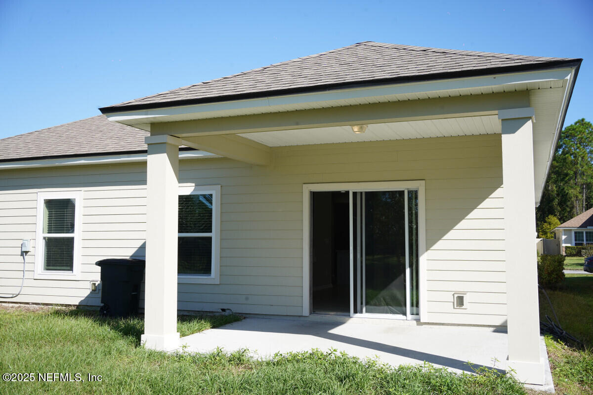 855 Sycamore Way Orange Park, FL 32073 - Photo 5 of 43 a view of a house with a small yard