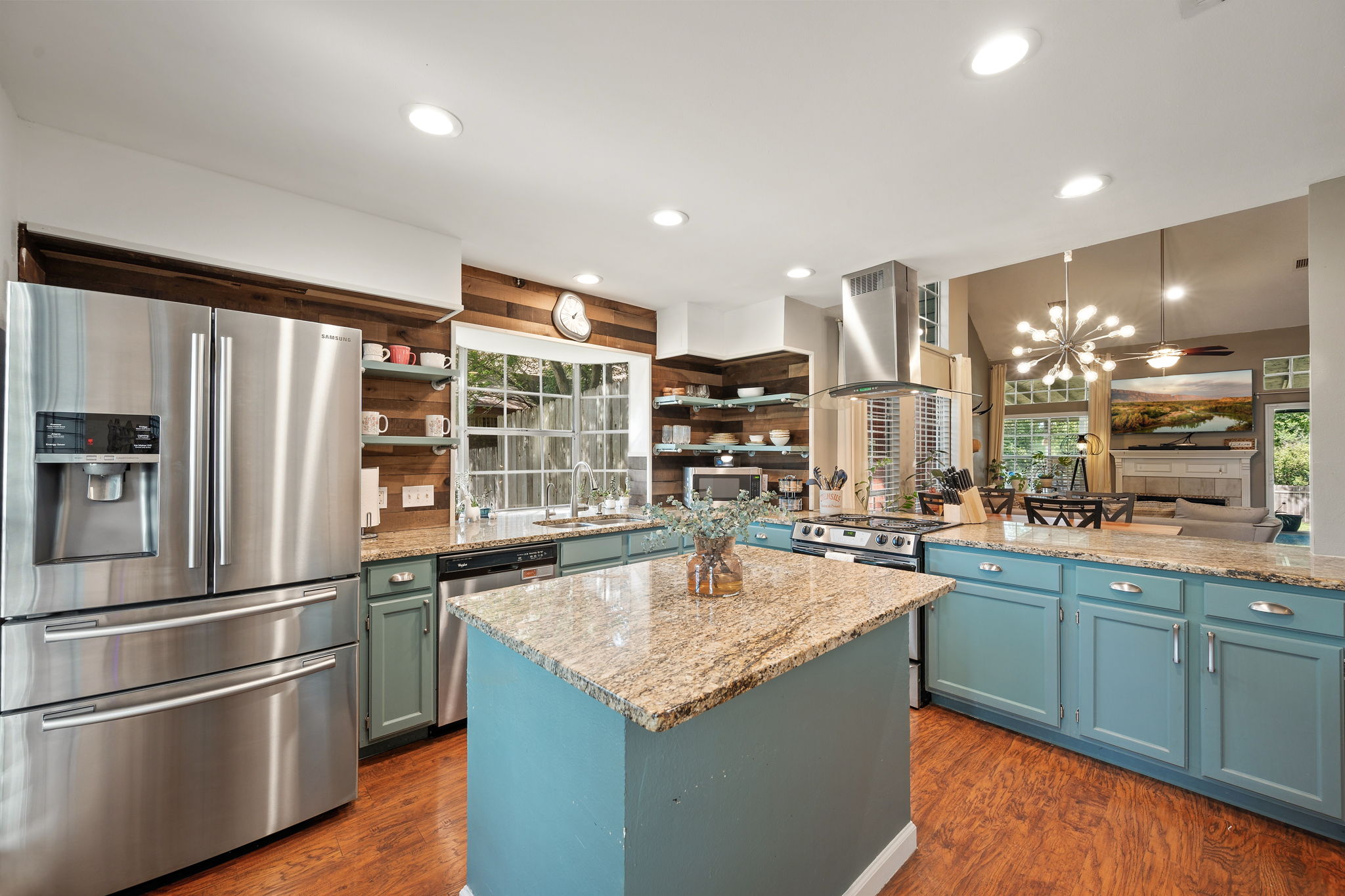 705 Canyon Bend Road Pflugerville, TX 78660 - Photo 5 of 23 a kitchen with stainless steel appliances granite countertop a sink and a refrigerator