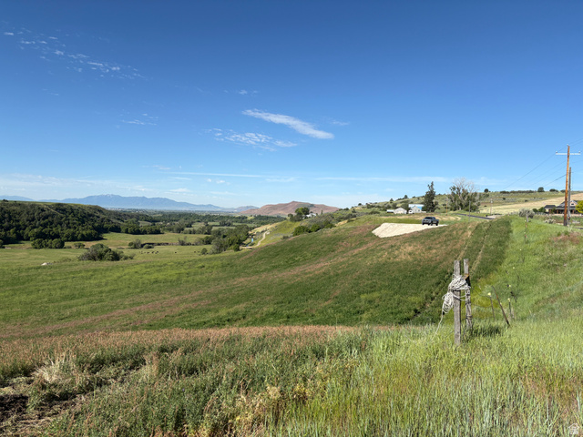 4250 East Cub River Road Preston, ID 83263 - Photo 1 of 18 Expansive green hillside property with distant mountain range