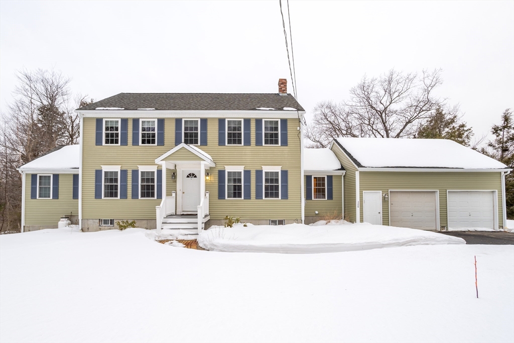 326 Matthews Street Gardner, MA 01440 - Photo 1 of 42 a front view of a house with a yard covered in snow