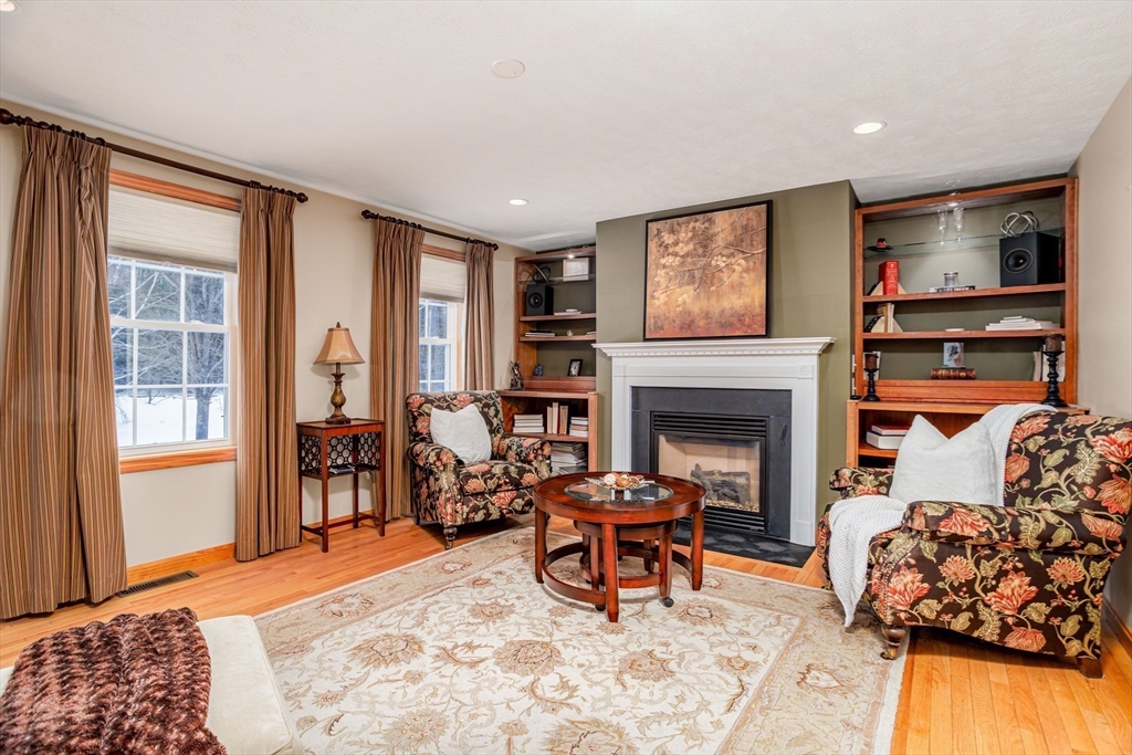 326 Matthews Street Gardner, MA 01440 - Photo 11 of 42 a living room with furniture and a fireplace