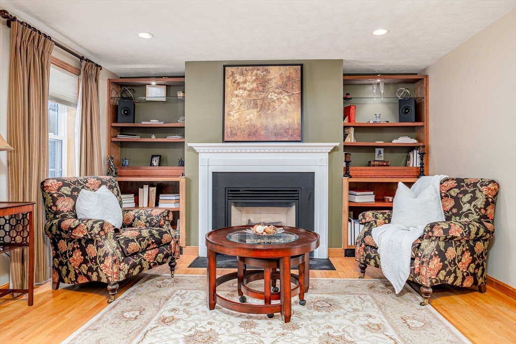 326 Matthews Street Gardner, MA 01440 - Photo 14 of 42 a living room with furniture and a fireplace