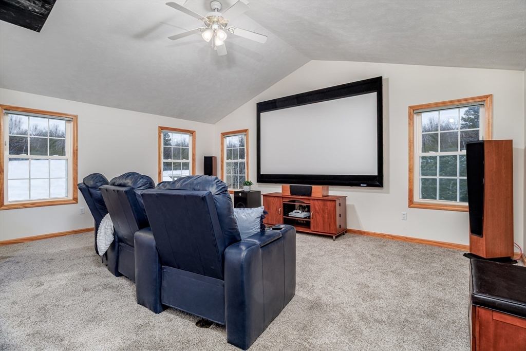 326 Matthews Street Gardner, MA 01440 - Photo 16 of 42 a living room with furniture and a flat screen tv